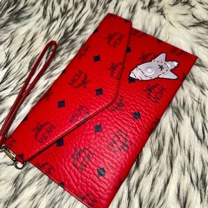 Red and Black MCM Clutch/Wrislet Bag W. Space Rocket Emblem